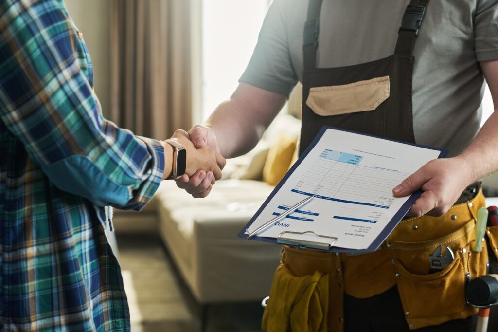 homeowner meeting with roofer