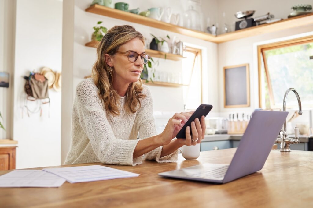 woman checking for roof leak repair costs