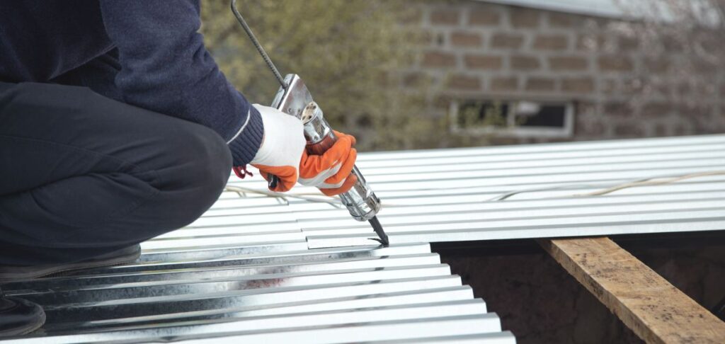 roofer using caulking gun