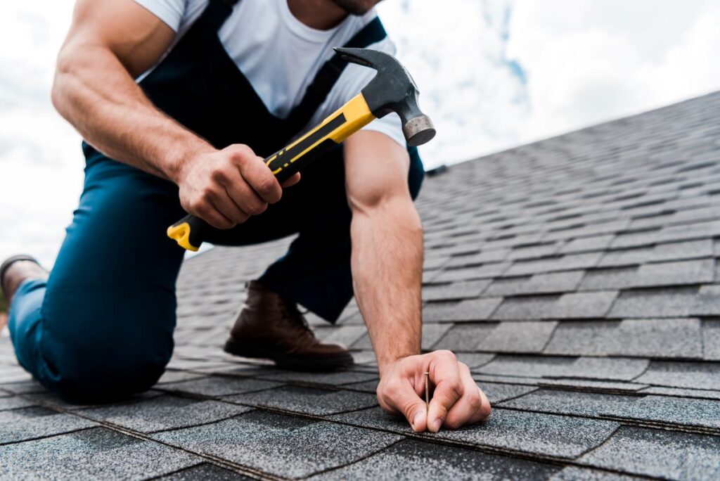 roofer using hammer