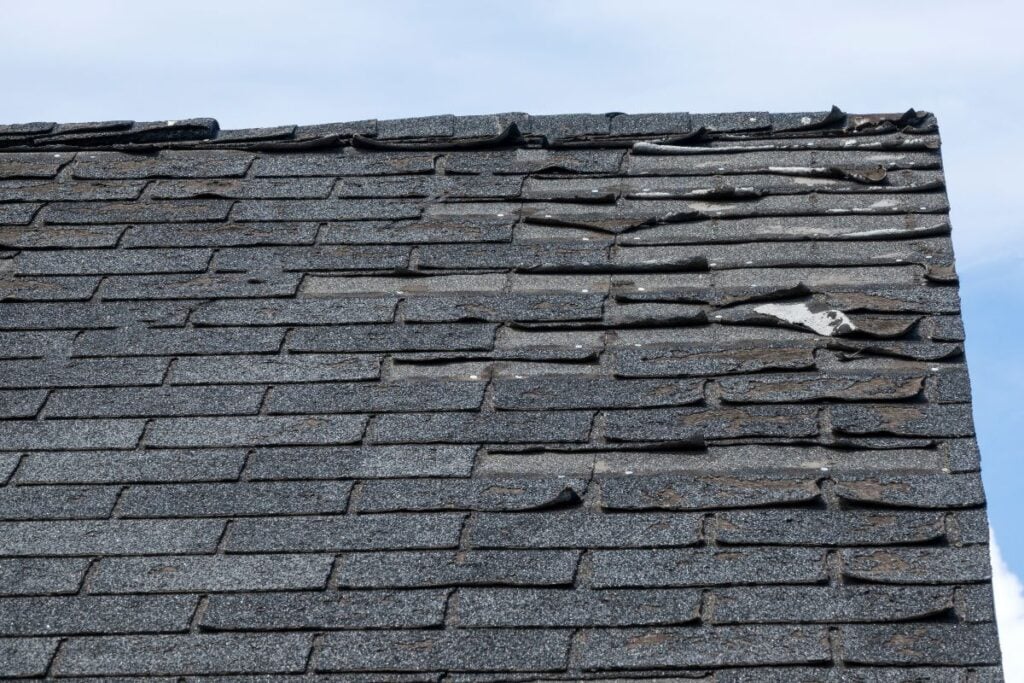 Badly damage roof shingles