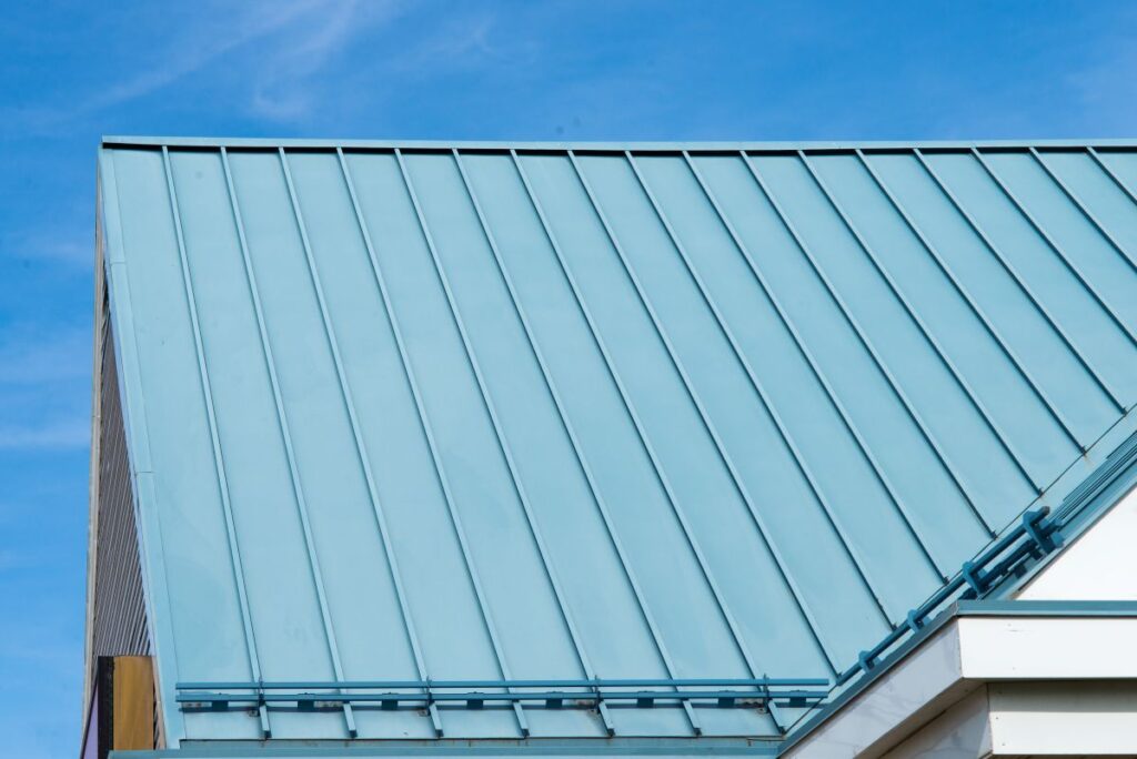 standing seam vs corrugated metal roof blue sky snow guards