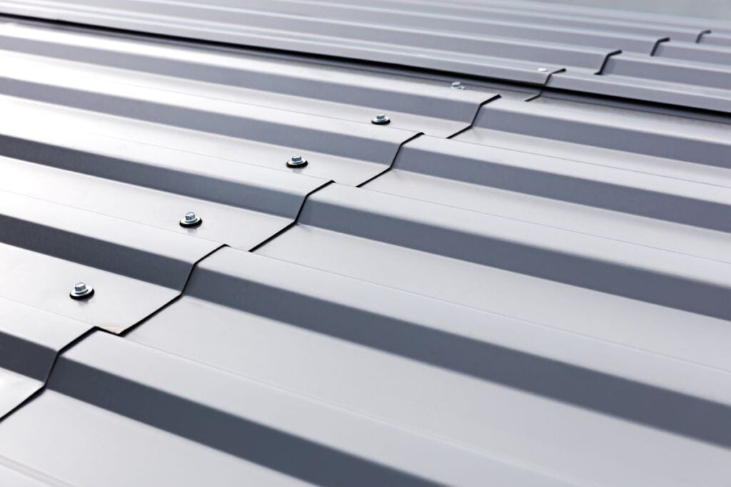 standing seam vs corrugated metal roof close up metallic material