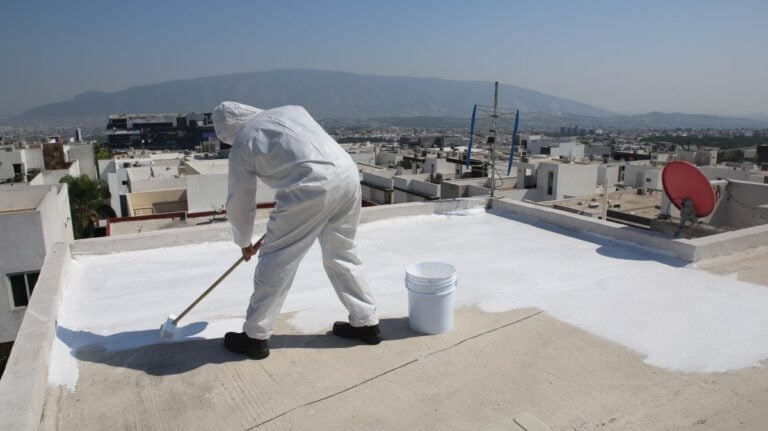 water proof membrane worker installing white coat