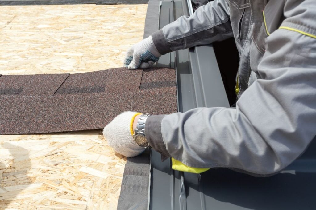 brown roof shingle colors worker using gloves