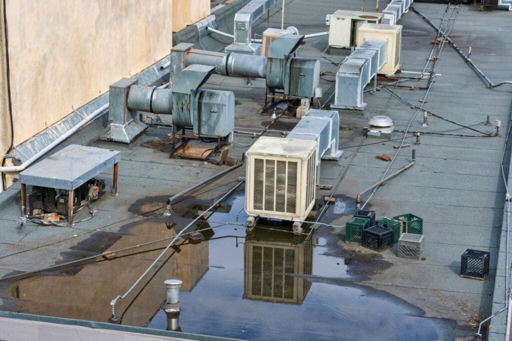 flat roof coating options water on top of roof