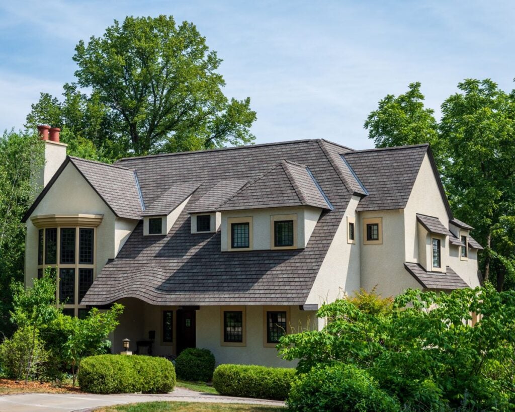 most durable roofing material big house light yellow wall